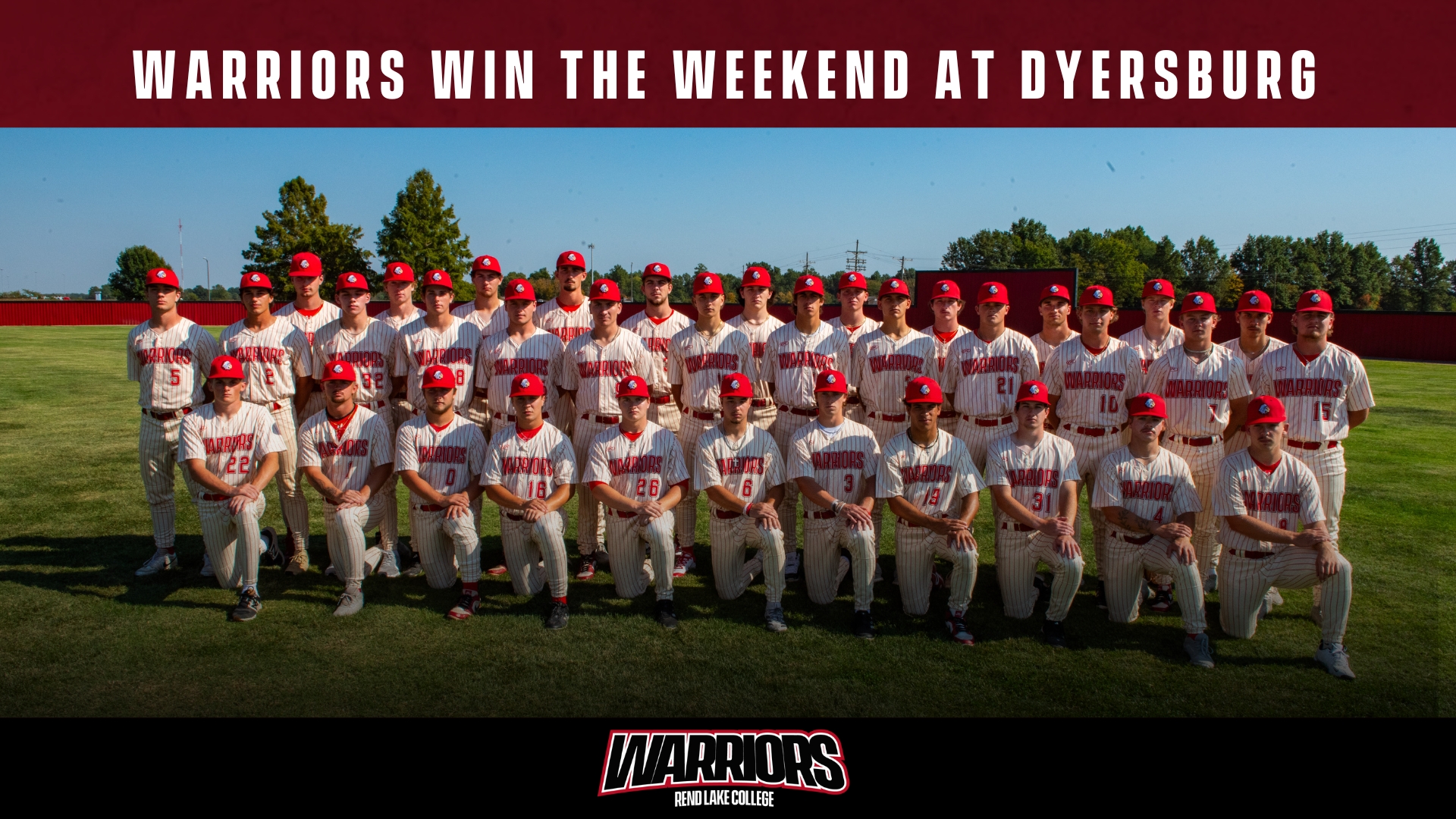 A team photo of the Rend Lake College Warriors baseball team posing on a grassy field under a clear blue sky. The image is framed by a maroon header at the top with the text 
